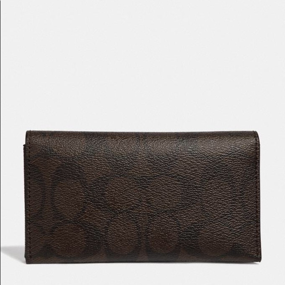 Coach Men's Universal Phone Case can be used as a wallet